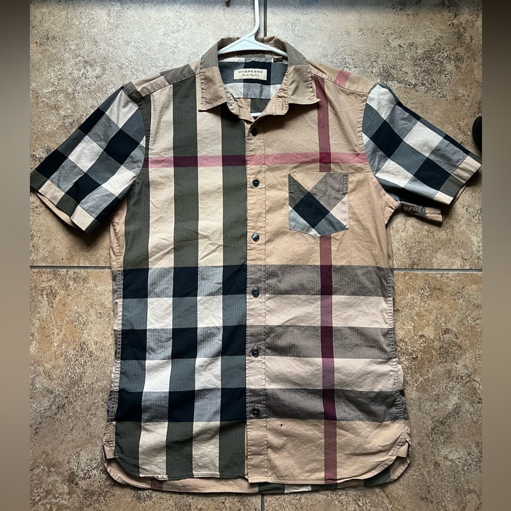 Burberry button up polo 

Size S men 

Small hole on bottom in photo